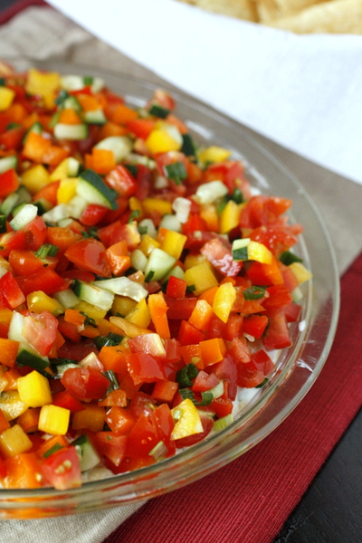 Loaded Veggie Dip - A healthy dip with layers of hummus, Greek yogurt, and a ton of freshly diced veggies. Delicious and guilt-free!